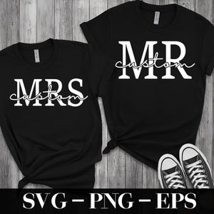 May include: Two black t-shirts with white text. One says "MRS custom" and the other says "MR custom". The shirts are displayed with a pair of black and white trainers.