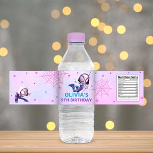 May include: A clear water bottle with a pink cap and a custom label. The label features a Spider-Gwen character design, spiderwebs, and the text "OLIVIA'S 5TH BIRTHDAY" in teal. A nutrition facts label is also visible.
