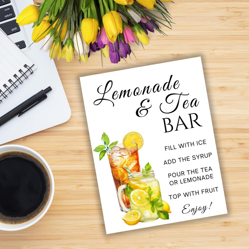 May include: A white sign with the words "Lemonade & Tea BAR" in black script. The sign features illustrations of iced tea and lemonade, with instructions: "Fill with ice, add the syrup, pour the tea or lemonade, top with fruit, enjoy!"