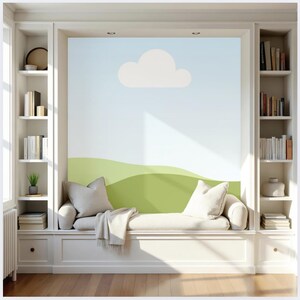 May include: A built-in window seat with a light blue and green mural featuring a cloud and rolling hills. The seat has white cushions, pillows, and a blanket. Bookshelves flank the seat, filled with books and decorative items. The room has a bright, airy feel.