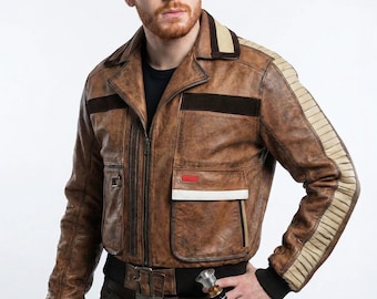 May include: A brown leather jacket featuring a black ribbed waistband and cuffs, dark brown horizontal chest stripes, and cream-colored ribbed detailing along the sleeves. The jacket includes a front zipper, a small red rectangular accent, and a white pocket trim.