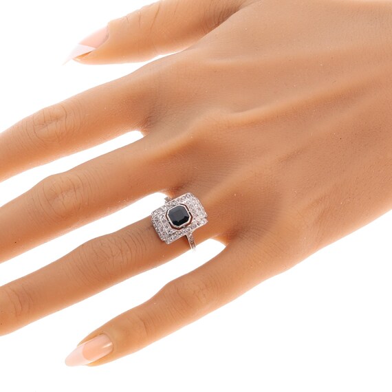 Circa 1930 Art Deco sapphire ring framed by fifty rose cut diamonds View 3