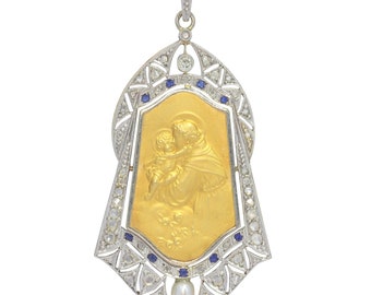 Vintage 1910's medal 18K gold pendant set with diamonds sapphires and pearl St. Anthony of Padua depicted holding the Child Jesus