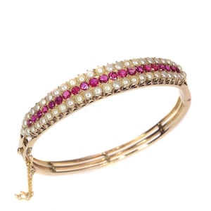 Vintage antique gold bangle with natural pearls and rubies sold by Simons Jewellers The Hague & Amsterdam