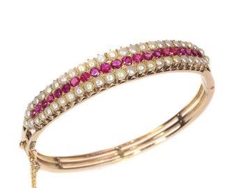 Vintage antique gold bangle with natural pearls and rubies sold by Simons Jewellers The Hague & Amsterdam