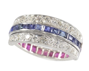 Magnificent eternity band with rubies and sapphires and hinged diamond parts