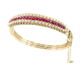 Vintage antique gold bangle with natural rubies and pearls sold by Simons Jewellers The Hague & Amsterdam