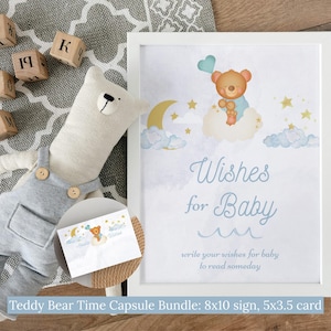 Peut inclure: Un panneau encadré avec une illustration d'ours en peluche et le texte "Wishes for Baby". L'image comprend une poupée ours en peluche, des blocs de bois avec des lettres et des chiffres et une petite carte avec un design assorti. Le panneau mesure 20x25 cm.