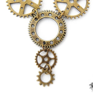 Close-up photo of the Steampunk gear necklace featuring intricately detailed bronze-tone gears and cogs. Lightweight design ensures comfort, while interlocking gears add depth and movement. Ideal for cosplay, themed events, or unique statement accessories. A great gift for fans of quirky, alternative jewelry styles.
