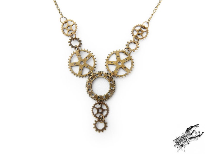 Steampunk gear necklace featuring intricately detailed bronze-tone gears and cogs. This handmade necklace showcases a vintage industrial aesthetic, perfect for steampunk enthusiasts and mechanical-inspired fashion lovers. Lightweight design ensures comfort, while interlocking gears add depth and movement. Ideal for cosplay, themed events, or unique statement accessories. A great gift for fans of quirky, alternative jewelry styles.