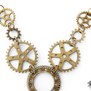 Close-up photo of the Steampunk gear necklace featuring intricately detailed bronze-tone gears and cogs. Lightweight design ensures comfort, while interlocking gears add depth and movement. Ideal for cosplay, themed events, or unique statement accessories. A great gift for fans of quirky, alternative jewelry styles.