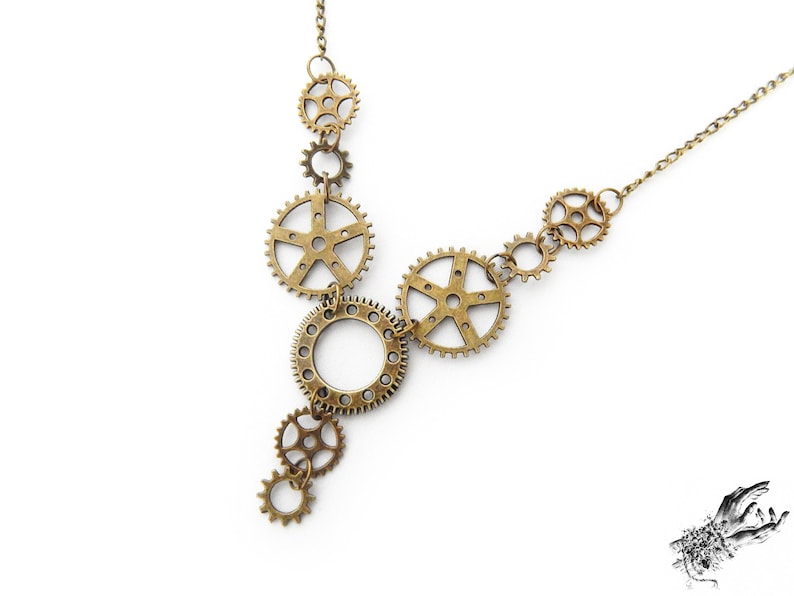 Steampunk gear necklace featuring intricately detailed bronze-tone gears and cogs. This handmade necklace showcases a vintage industrial aesthetic, perfect for steampunk enthusiasts and mechanical-inspired fashion lovers. Lightweight design ensures comfort, while interlocking gears add depth and movement. Ideal for cosplay, themed events, or unique statement accessories. A great gift for fans of quirky, alternative jewelry styles.