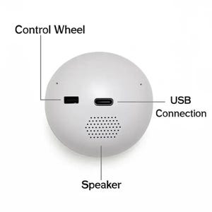 May include: A white, spherical device featuring a speaker, USB connection, and control wheel. The speaker is at the bottom, with the USB connection and control wheel on the sides. Designed for audio or data transfer.
