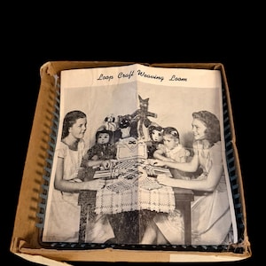 May include: A vintage Loop Craft Weaving Loom kit. The box contains a black and white photo of several people weaving at a table. The text "Loop Craft Weaving Loom" is printed at the top of the photo. The box is brown with a blue trim.