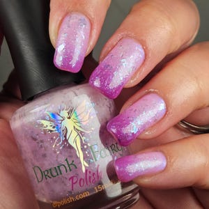 Purple Rain | A Solar Polish that Shifts from Pale Pink to Dark Pink with Multichrome Flakes, Aurora Shimmer, and Reflective Holo Glitter