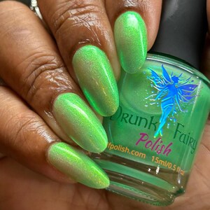 Bioluminescence | A Neon Apple Green Nail Polish with a Gold to Green to Blue Aurora Shimmer