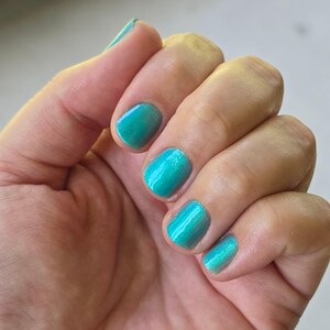 Teal Me Lies | A Solar Nail Polish that Shifts from Teal (inside) to Dark Teal (outside) with an Aurora Shimmer