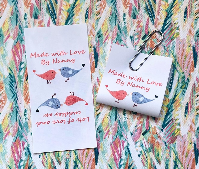 personalised craft labels for handmade items. washable sew-in loop labels. multi-colour labels with a picture of love birds, personalised with your own text.