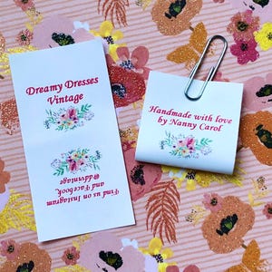 personalised craft labels for handmade items. washable sew-in loop labels. multi-colour labels with a picture of flowers, personalised with your own text.