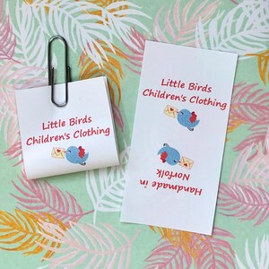 personalised craft labels for handmade items. washable sew-in loop labels. multi-colour labels with a picture of a little bird delivering a love letter, personalised with your own text.