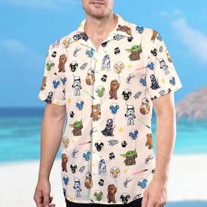 May include: A white ceramic mug with a black handle and the text "But First, Coffee" in a bold, black font. The mug is set against a blurred background, suggesting a cosy setting.