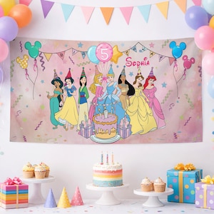 May include: A rectangular birthday banner featuring a pink watercolor background with illustrations of eight Disney princesses, a tiered cake, and the text '5' and 'Sophia'. The banner is decorated with colorful balloons, stars, and streamers.
