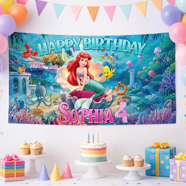 May include: A rectangular birthday banner featuring Ariel from The Little Mermaid sitting in a large seashell. The text reads Happy Birthday, Sophia, and the number 4. The background depicts an underwater scene with coral, fish, and sea creatures.