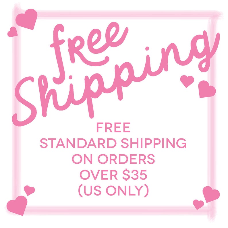 May include: A white background with pink text that reads "free shipping" in a cursive font. Below, smaller text states "FREE STANDARD SHIPPING ON ORDERS OVER $35 (US ONLY)". Pink hearts are scattered around the text.