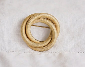 Trio of Rings Gold Tone Brooch