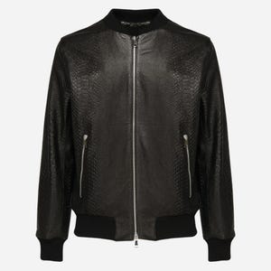 May include: A black bomber jacket featuring a textured snakeskin-like pattern throughout the body. The jacket includes a central silver zip, two side pockets with silver zips, and solid black ribbed knit trim at the collar, cuffs, and hem.