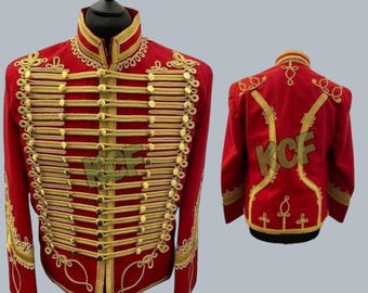 May include: A red military-style jacket with gold trim and buttons. The jacket has a high collar and a double-breasted closure. The back of the jacket features a decorative design.
