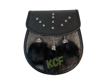 May include: A black leather sporran with a gray fur flap and three black fur tassels. The sporran has a decorative design with silver studs and the initials "KCF" are embossed on the fur flap.