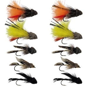 May include: Assortment of eight fly fishing lures with different colored feathers and bodies. The lures are tied with black, brown, orange, yellow, and white feathers.