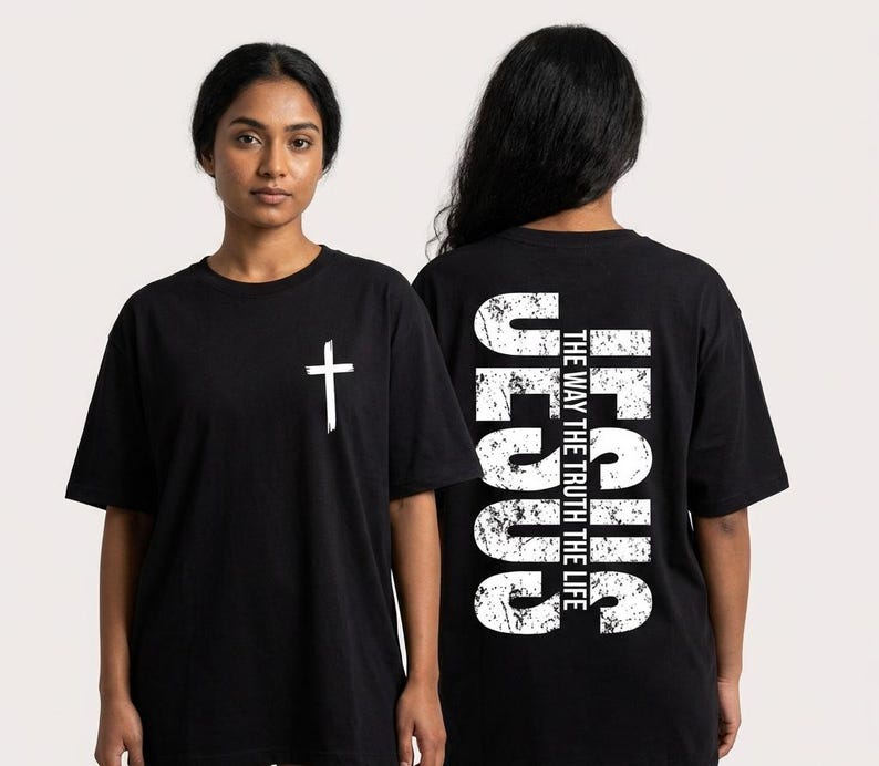 May include: Black t-shirts with white text and graphics. One shirt features a white cross on the front. The other shirt has the word "JESUS" vertically on the back, along with the text "THE WAY THE TRUTH THE LIFE."