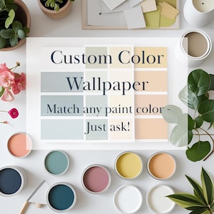May include: A flat lay featuring paint cans in various colors, a color palette, and the text "Custom Color Wallpaper. Match any paint color - Just ask!" The cans are open, revealing shades of blue, pink, yellow, and white.