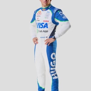 May include: A full-body shot of a person in a white and blue racing suit. The suit has sponsor logos, including "VISA" and "HUGO." The suit is accented with green trim and the person is wearing matching blue shoes.