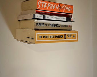 Libreria invisibile anti-danni con strisce adesive