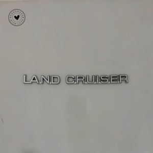 Toyota Land Cruiser Trunk Emblem (2002-2009): Chrome Tailgate Badge