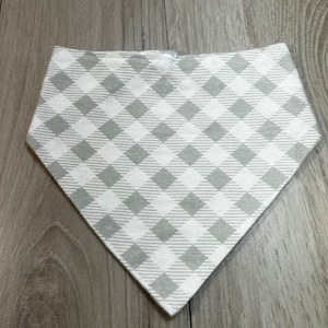 May include: A gray and white gingham bandana with a pointed bottom.