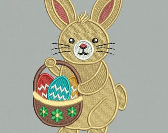 May include: An embroidered design of a brown bunny rabbit holding a basket of colorful Easter eggs. The design includes the text "3 Sizes" and "FILES FORMATS: DST, EXP, CND, XXX, JEF, HUS, PES, PDF."