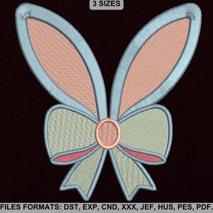 May include: A light blue and pink butterfly with a green bow. The butterfly has two large wings and a small body. The bow is tied in the center of the butterfly's body. The image includes the text "3 SIZES" and "FILES FORMATS: DST, EXP, CND, XXX, JEF, HUS, PES, PDF."