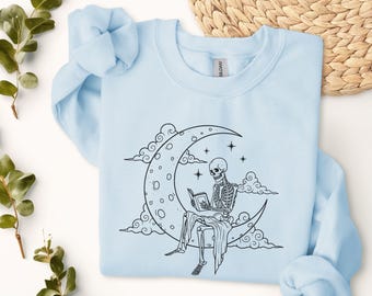 Skeleton Reading on Crescent Moon sweatshirt | Line Art Night Sky