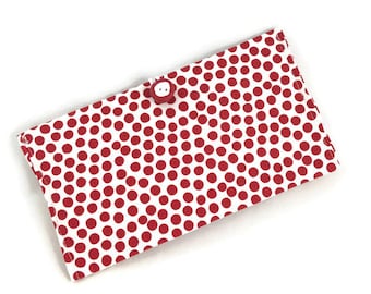 Red and white checkbook with button closure