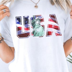 Camiseta com estampa patriótica dos EUA, camiseta com bandeira vintage, camiseta da Estátua da Liberdade, camiseta com letra dos EUA desgastada, camiseta Comfort Colors® do dia 4 de julho