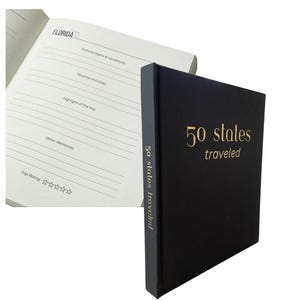May include: A black journal with gold lettering that says "50 states traveled". The journal has a lined interior with sections for each state, including "Favorite Sights & Landmarks", "Favorite Activities", "Highlight of the Trip", "Other Memories", and "Trip Rating".
