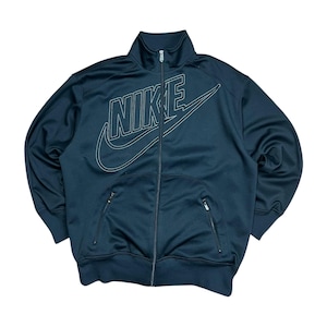 May include: A dark navy zip-up track jacket featuring the Nike logo in white. The jacket has a high collar, two zipped front pockets, and a full-length zip. The Nike logo is prominently displayed across the chest.