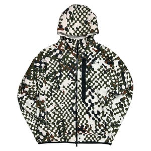May include: A full-zip hooded jacket with a unique pattern. The jacket features a white base with a repeating pattern of olive green, brown, and black shapes. It has a hood, a black zipper, and a small Nike logo on the chest.