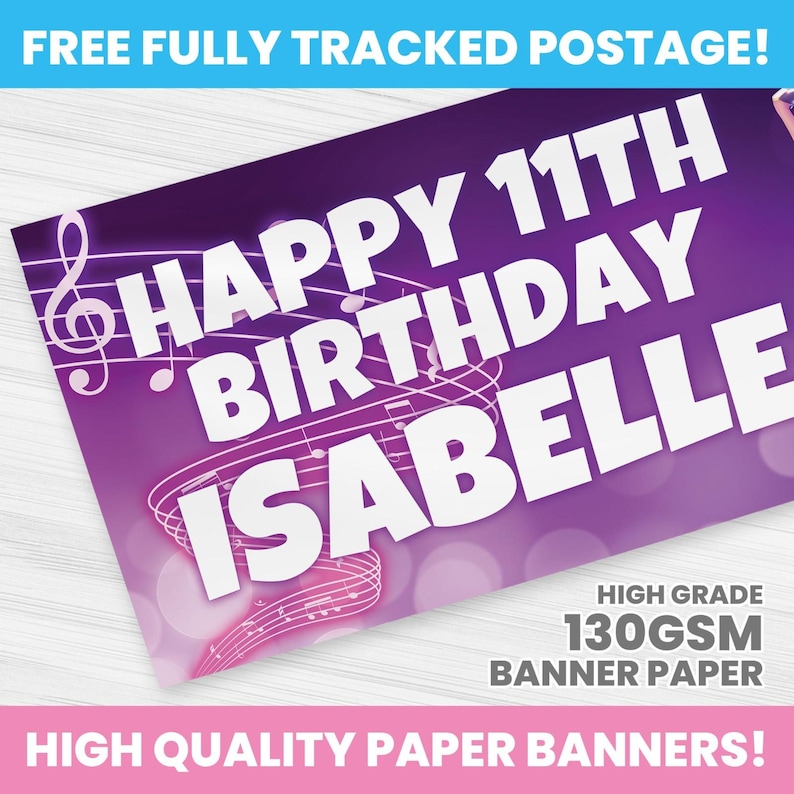 May include: A purple banner with the text "HAPPY 11TH BIRTHDAY ISABELLE" in white, with musical notes and a treble clef design. The banner also includes the text "HIGH GRADE 130GSM BANNER PAPER" and "HIGH QUALITY PAPER BANNERS!"
