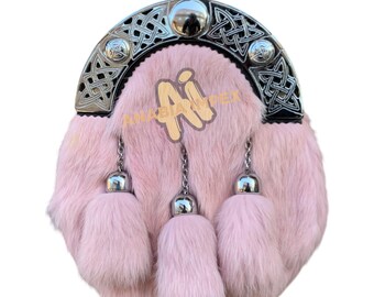 May include: A pink fur sporran with a silver Celtic knot design and three tassels.