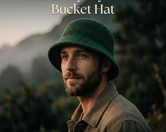 May include: A dark green crochet bucket hat with a textured, woven stitch pattern. The text "The Everyday Oasis Bucket Hat" and "Crochet Pattern" is displayed in white lettering against the background of the image.